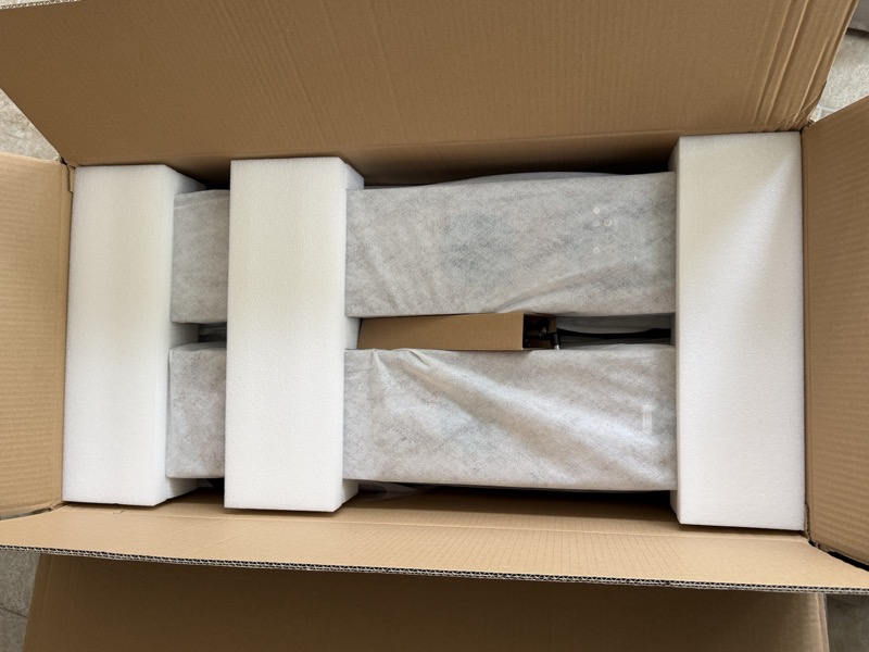 both speakers secured in the shipping box