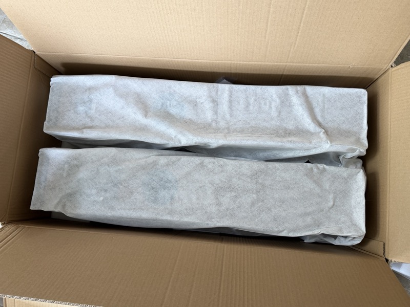 speakers still wrapped in the box