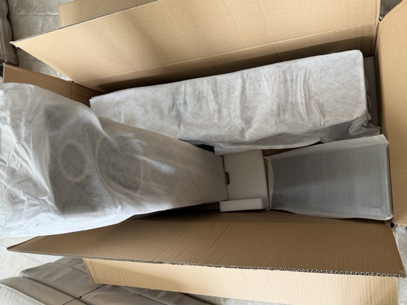 taking out one of the speakers still in its wrap