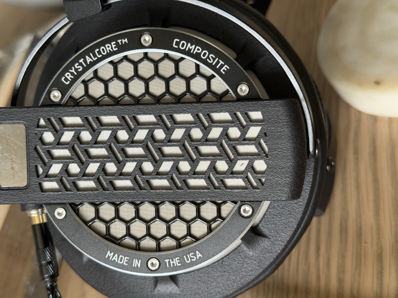 earcup back grille on a wood surface