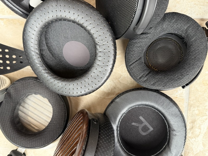 the Genesis One’s earpads scattered among the wider collection