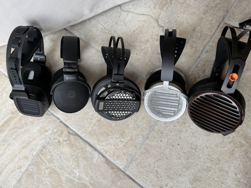 the Genesis One lined up with several open-back headphones from the collection