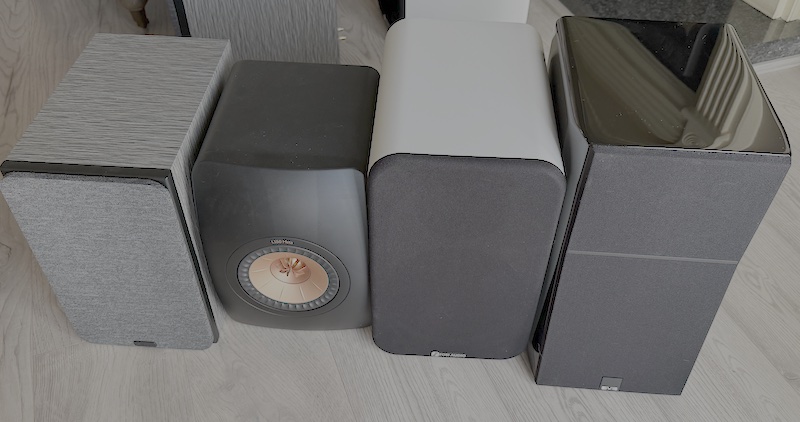 ultra evolution alongside a larger bookshelf speaker for size reference